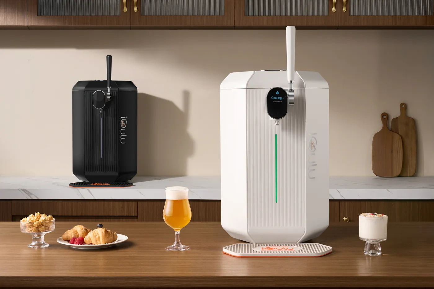 White iGulu F2 smart home brewer beside the black model and a glass of beer
